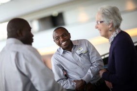 Shared Interest member talking to staff at our AGM in 2015